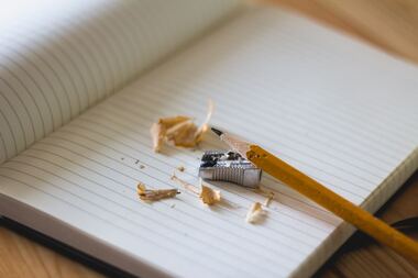 Pencil shavings on a notebook - PicturePhoto by Angelina Litvin on Unsplash